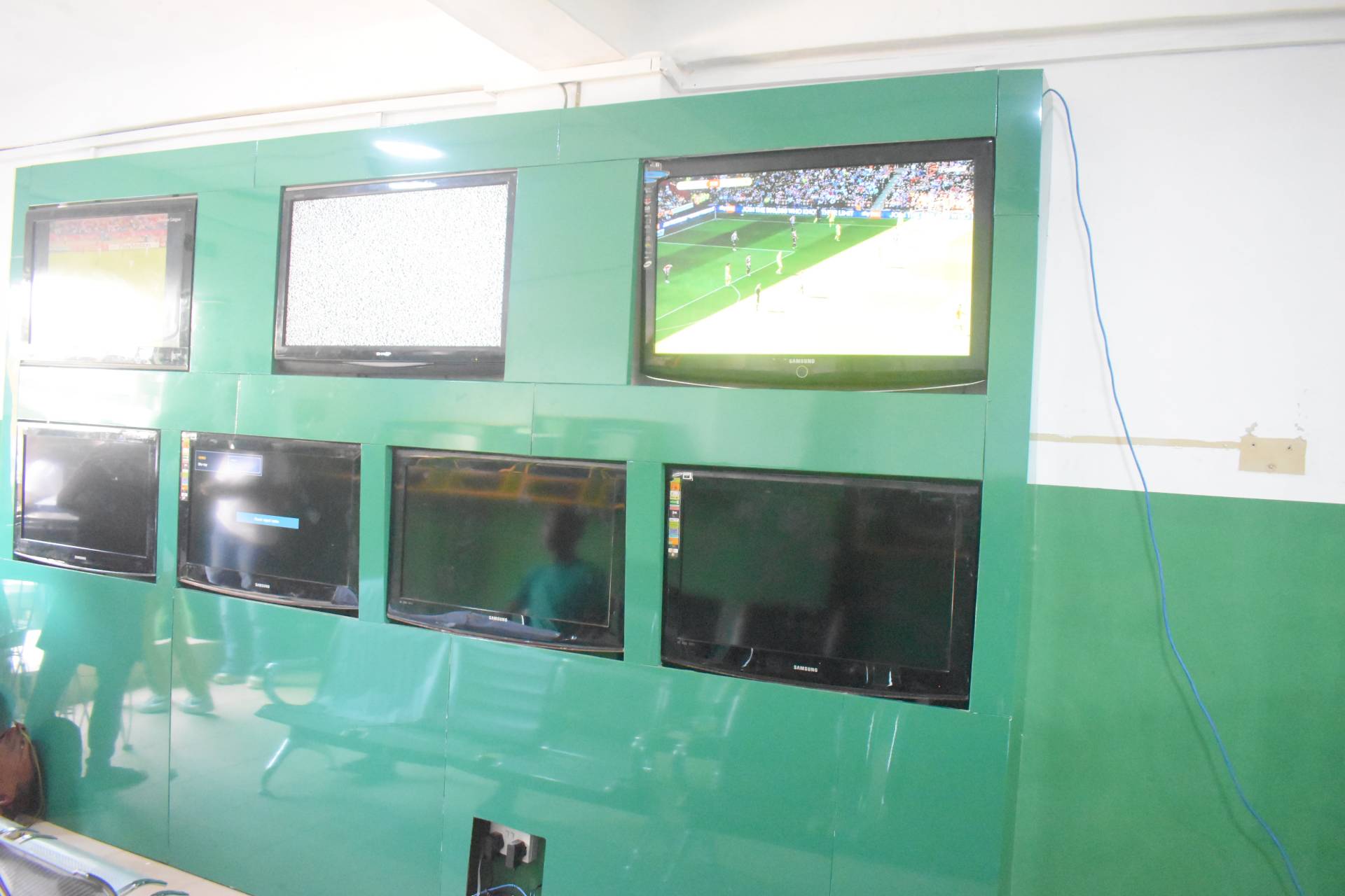 Inside view of Frapapa bet shop in Somolu with TVs